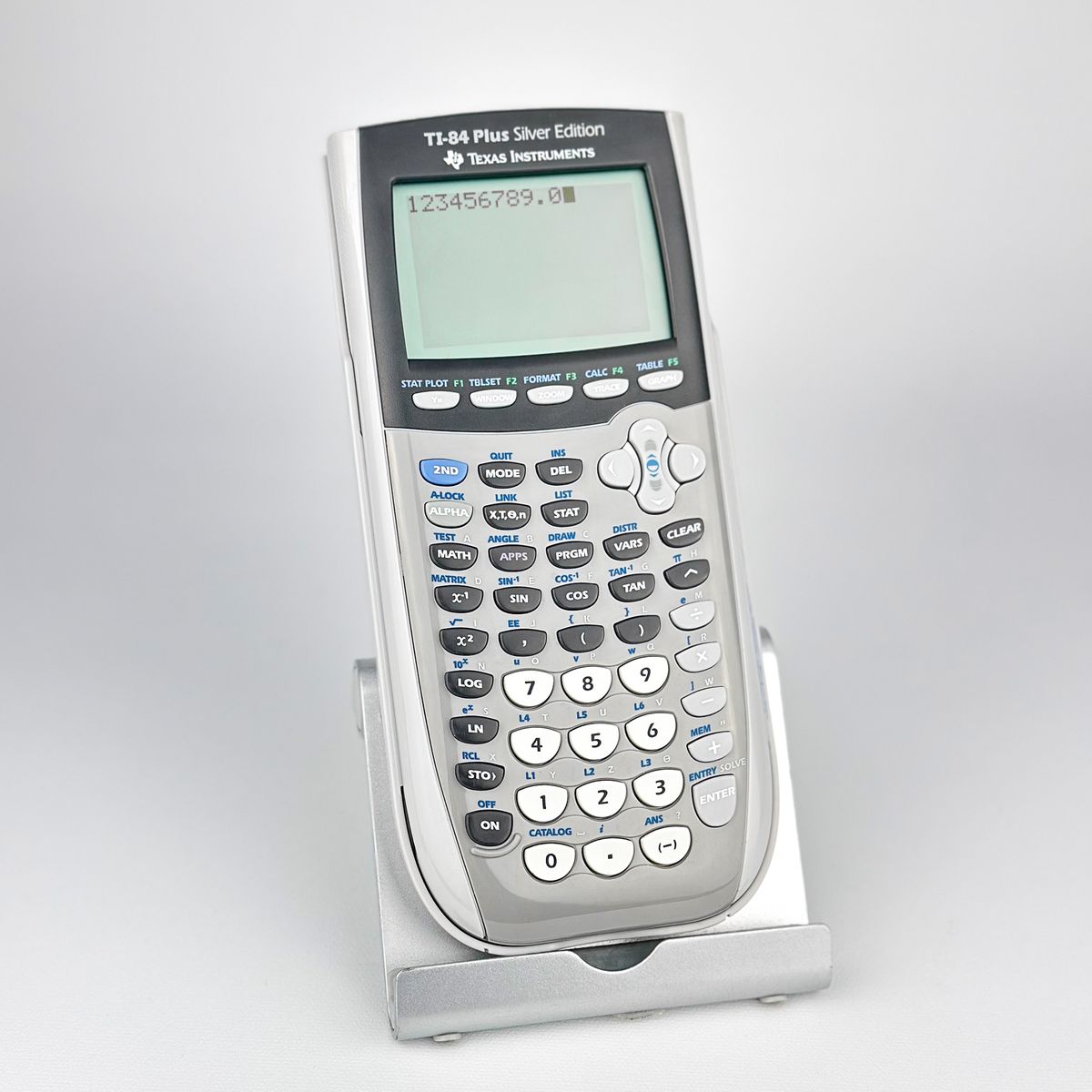 Texas Instruments TI-84 Plus Silver Edition Graphing Calculator with Cover, Manual, and Extras