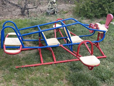 Playground airplane teeter totter