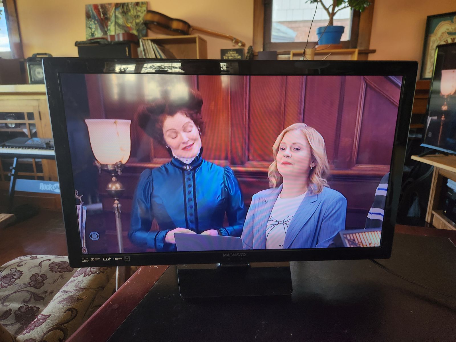 Magnavox HD TV and universal remote (with manual).  Works great.  Has all the connections you want.  Thin and modern.