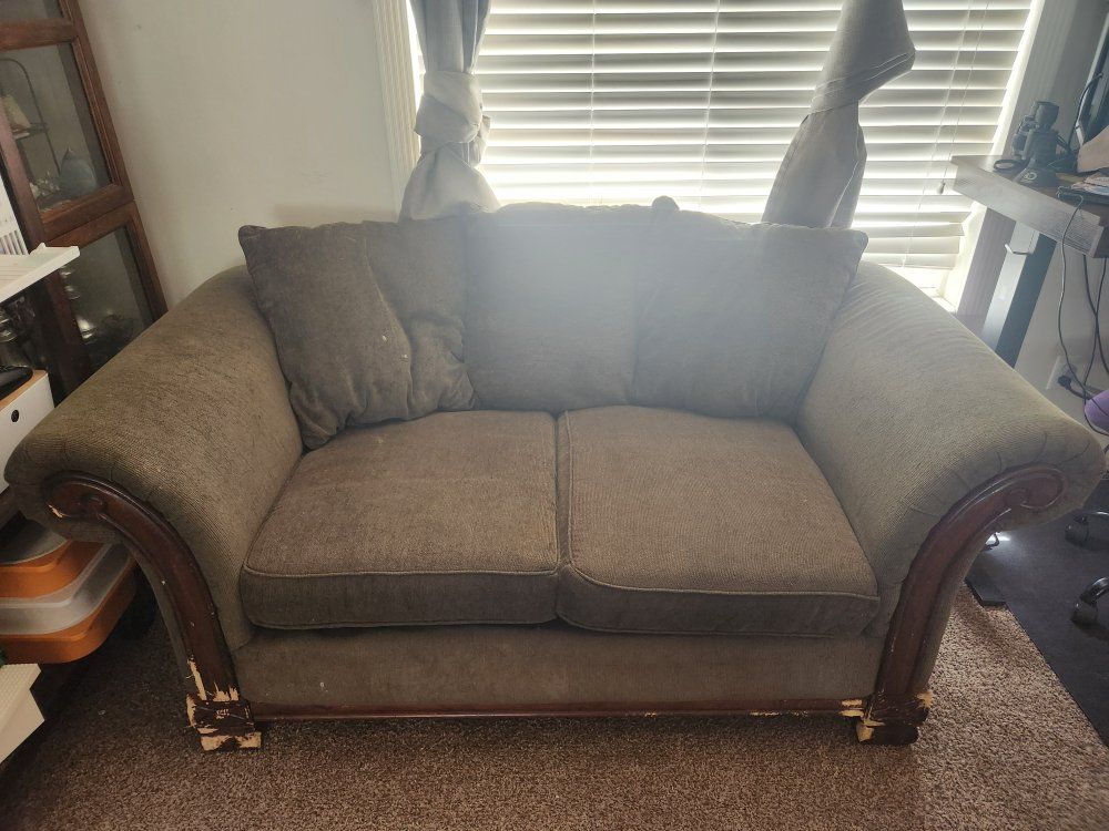 Green Fabric Loveseat with Wooden Trim and Reversible Cushions