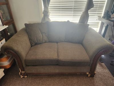 Green Fabric Loveseat with Wooden Trim and Reversible Cushions
