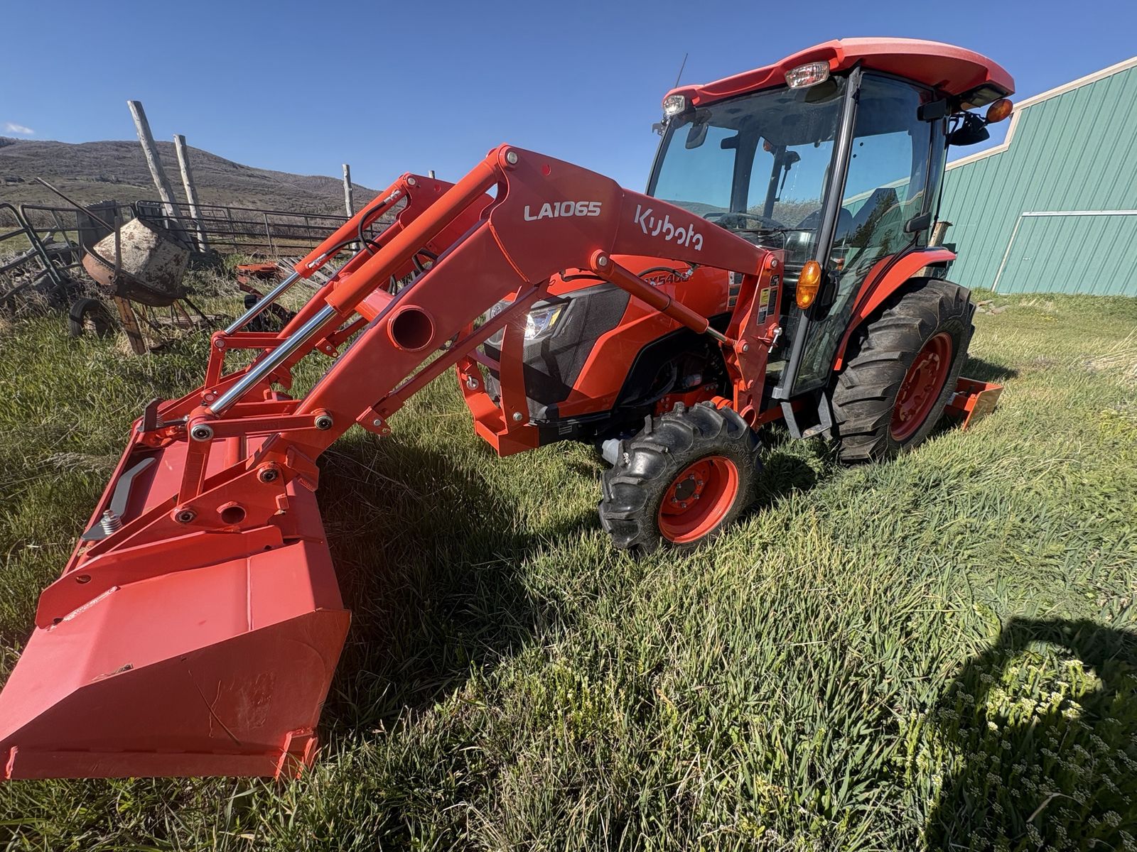 2020 Kubota MX5400 Utility Tractor with Enclosed Cab and LA1065 Front Loader Attachment