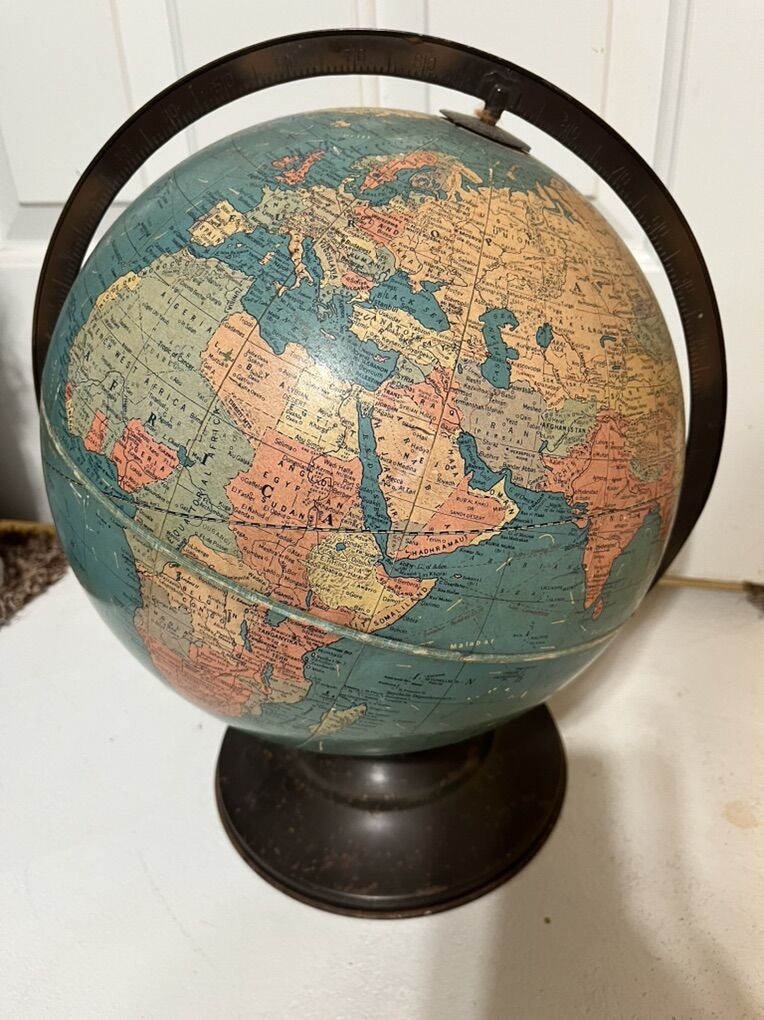 Old world spinning globe with metal stand