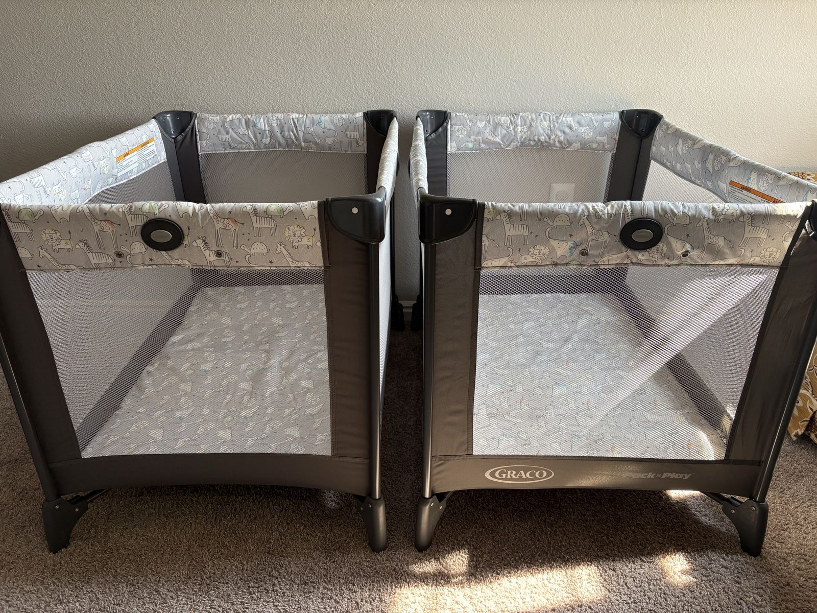 Two Graco Pack and Play Portable Cribs