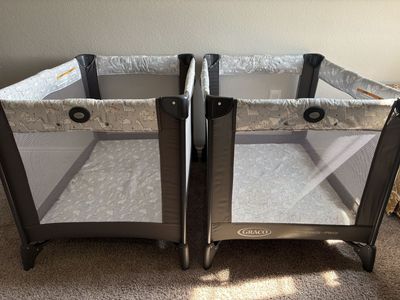 Two Graco Pack and Play Portable Cribs