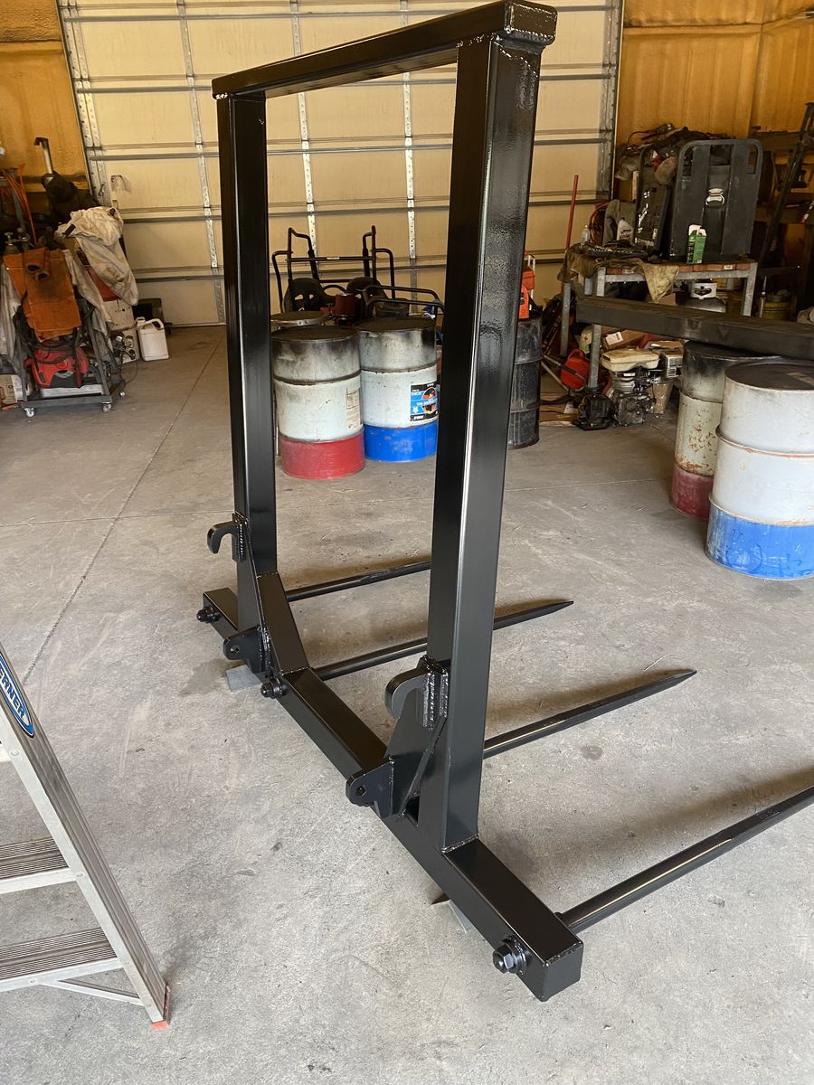 Custom made bale forks and trailer mover hitches