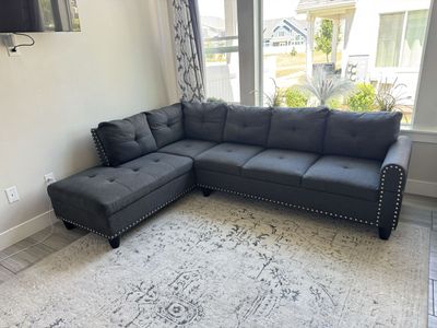 Spacious Dark Gray Sectional Sofa with Storage Chaise and Nailhead Trim - Excellent Condition