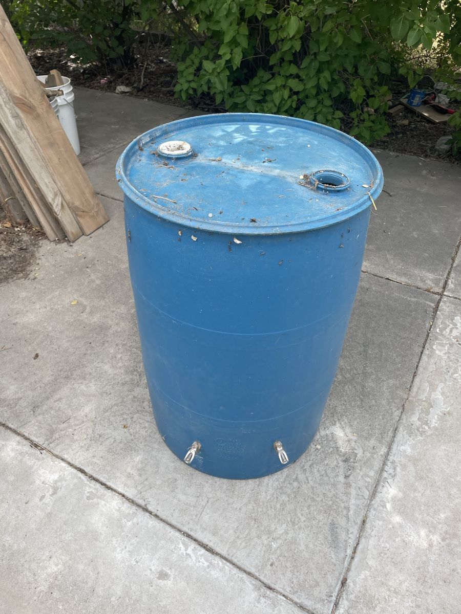 Blue Plastic Rain Barrel with Spigots - Used for livestock Watering