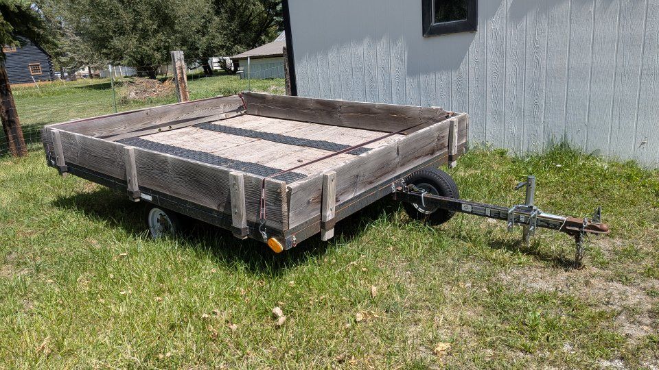 Utility Trailer with Wooden Stake Sides and Metal Frame