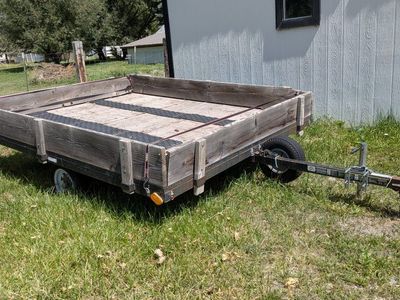 Utility Trailer with Wooden Stake Sides and Metal Frame