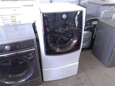 LG front load electric dryers on pedestals