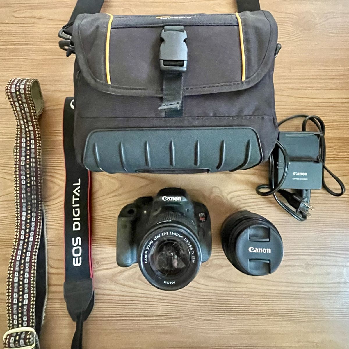 Canon T5i camera with extra lens and gear.