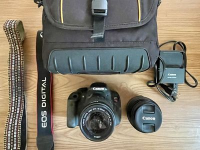 Canon T5i camera with extra lens and gear.
