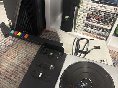 Xbox 360 Console Bundle with DJ Hero Turntable, Guitar Hero Controller, and 15 Games