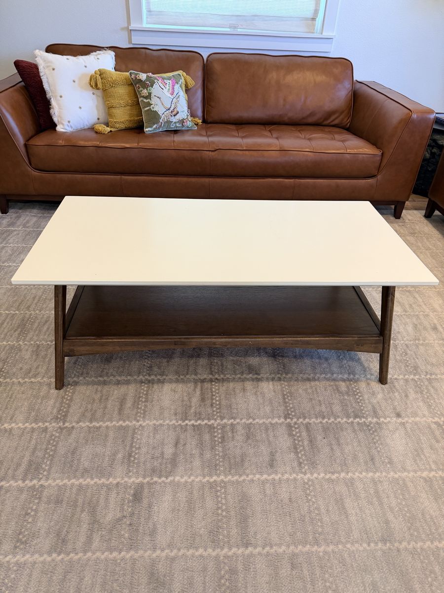 Solid coffee table with shelf