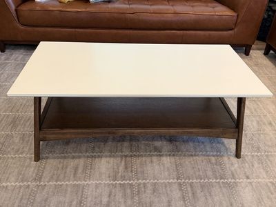 Solid coffee table with shelf