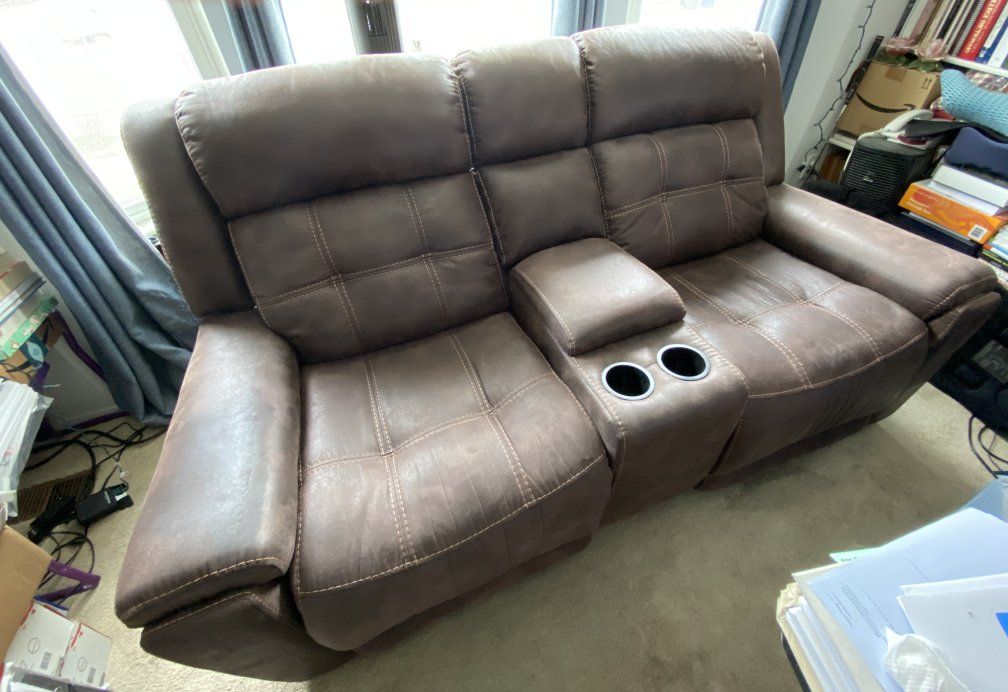 lightly used faux leather 2 seater power reclining couch