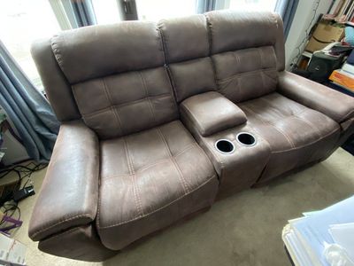 lightly used faux leather 2 seater power reclining couch