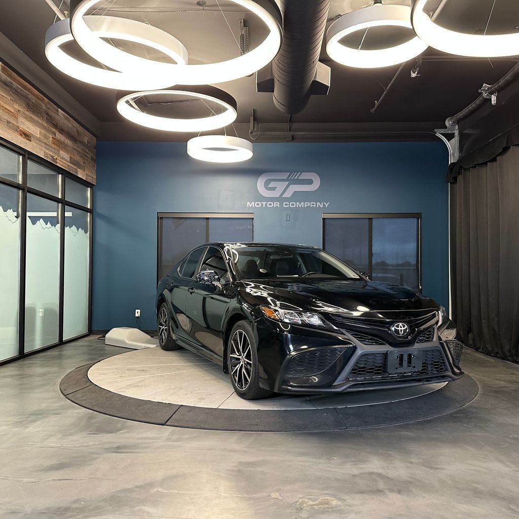 2021 Toyota Camry SE — rebuilt & branded title, 29% below market