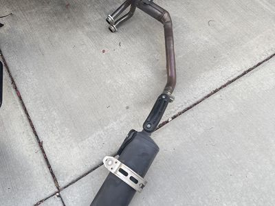 Motorcycle Exhaust Pipe & Muffler Assembly, 2024 Yamaha Tenere 700 with 1,000 miles.