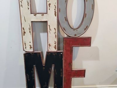 "HOME" rustic wall decor with a distressed finish