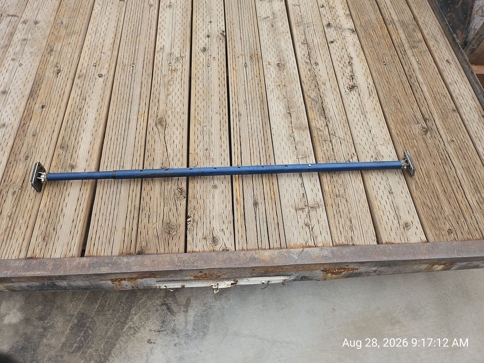 Used adjustable blue telescopic cargo bar or load-lock stabilization pole