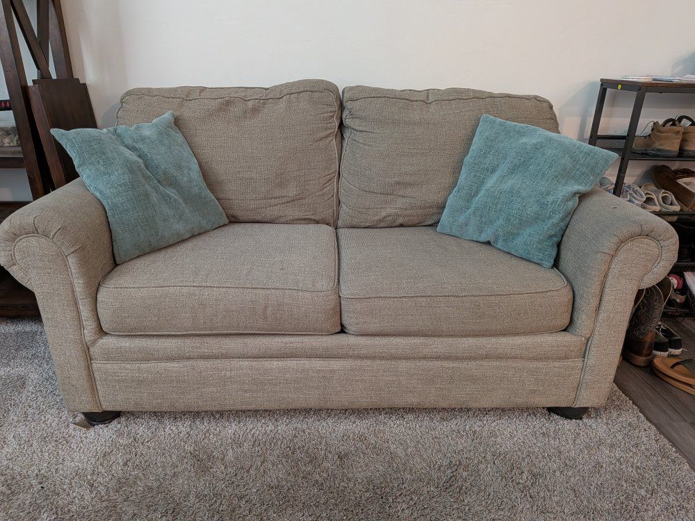 Beige loveseat for sale! Yippee!