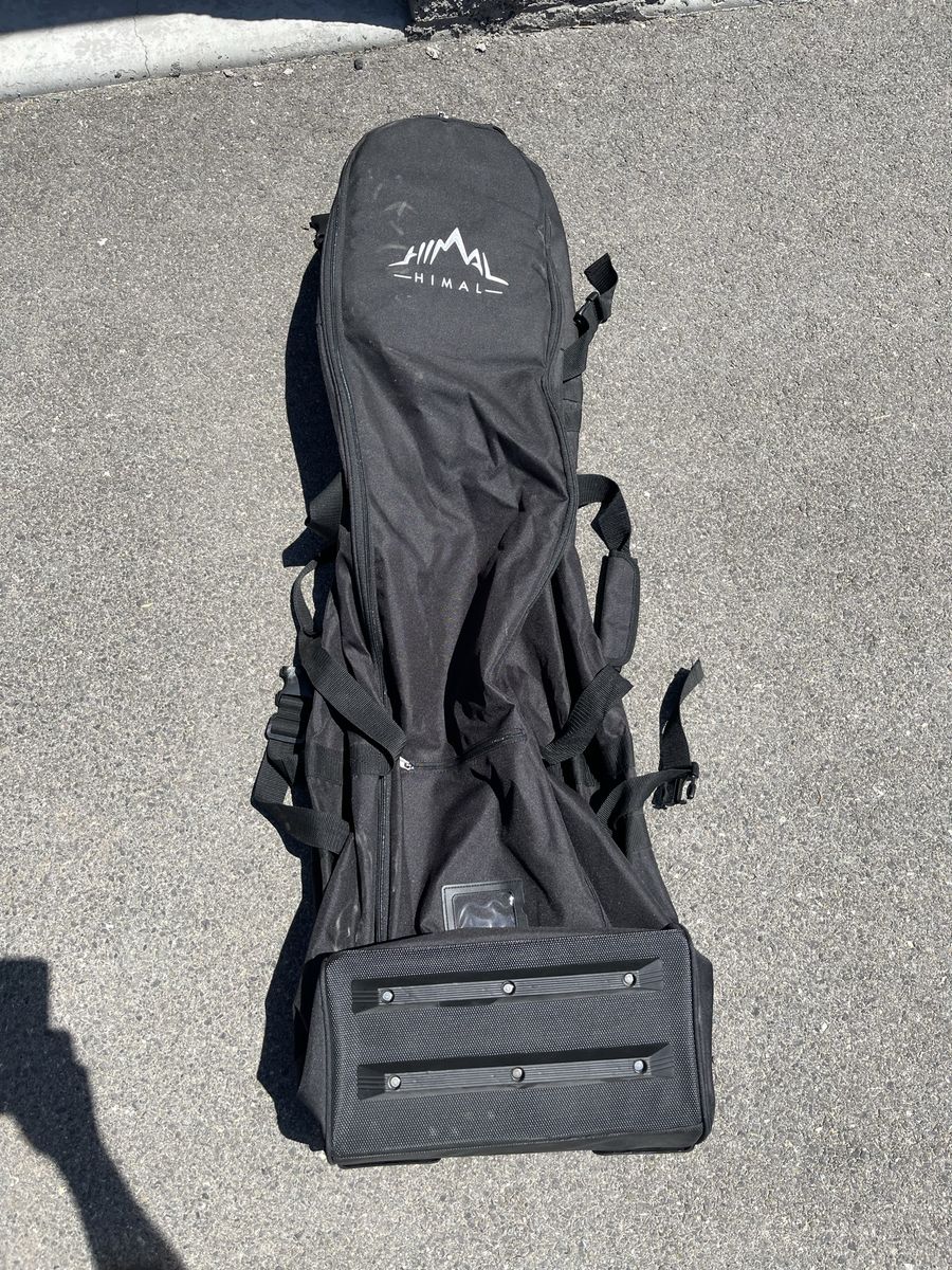 HIMAL soft sided golf bag Carrier with roller wheels- never used and has been in storage.