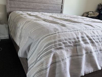 Queen Size Wooden Bed Frame - Gray/Brown Finish, Slat Headboard, Platform Style, with box spring.