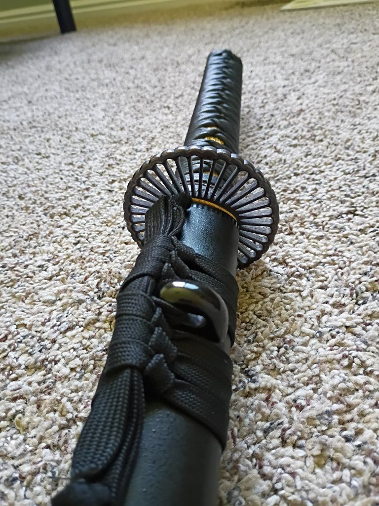 Japanese Samurai Katana Sword with Black Scabbard and Ornate Tsuba