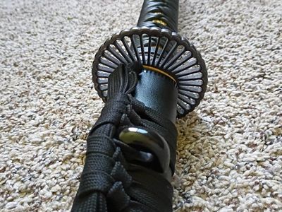Japanese Samurai Katana Sword with Black Scabbard and Ornate Tsuba