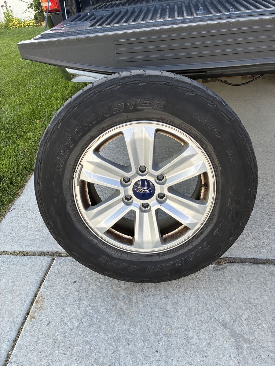 2016 Ford F-150 XLT Stock Wheels & Motomaster Total Terrain A/T3 Tires (2 good, 2 worn)