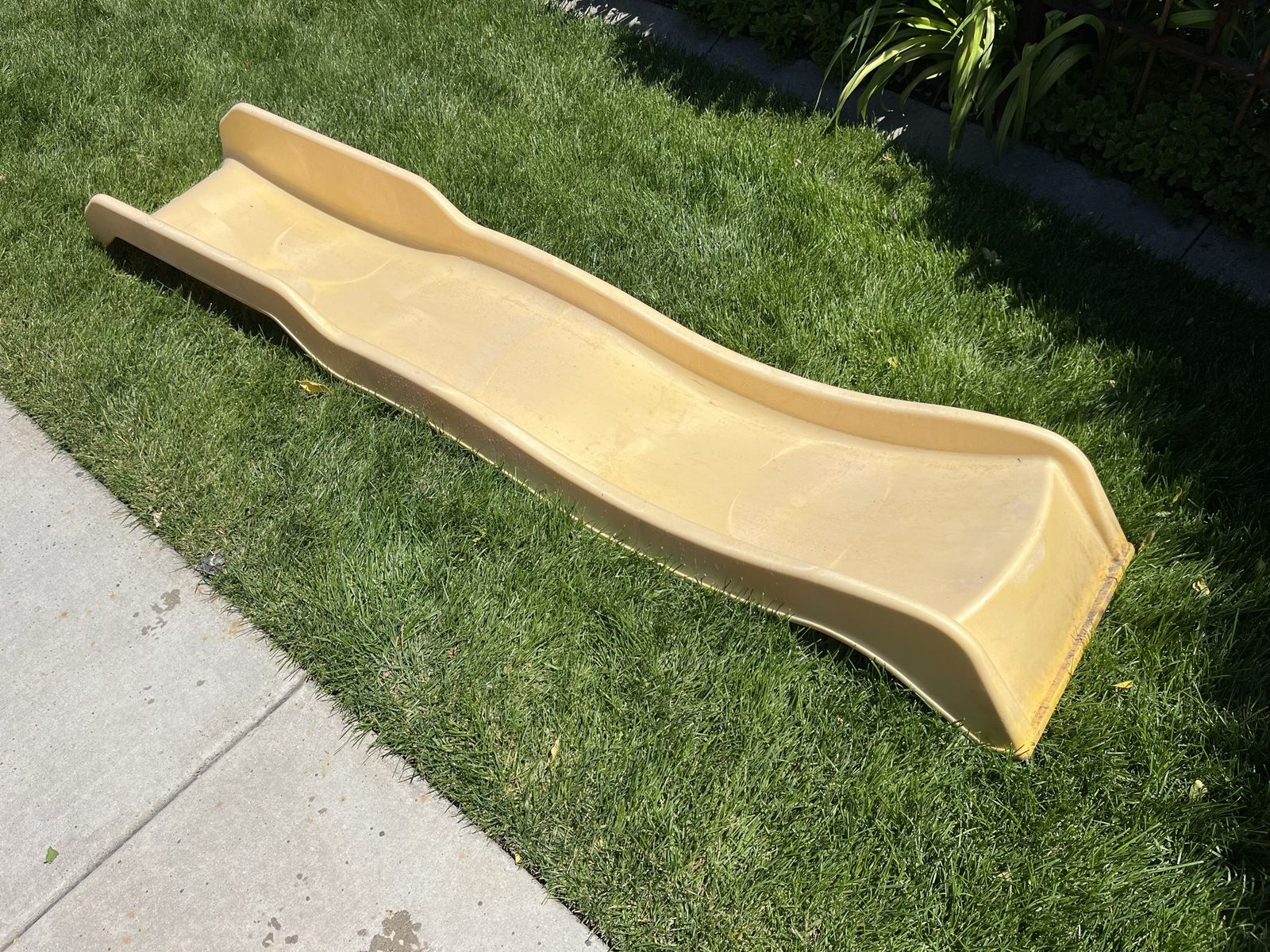 Swingset yellow play slide only a little over 7 feet long.