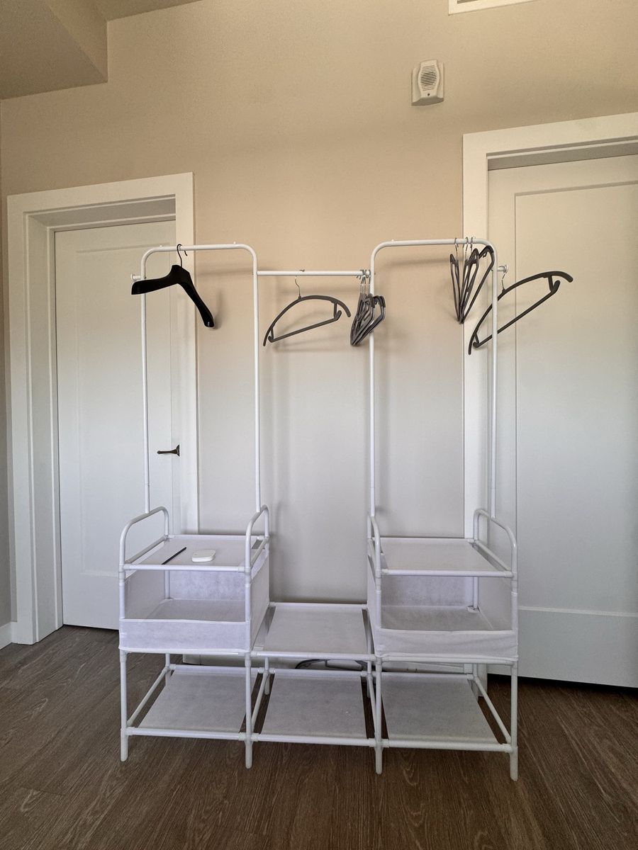 2 White Clothing Racks with Shelves - One New in Box - Must Pick Up Today