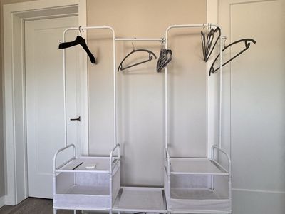 2 White Clothing Racks with Shelves - One New in Box - Must Pick Up Today
