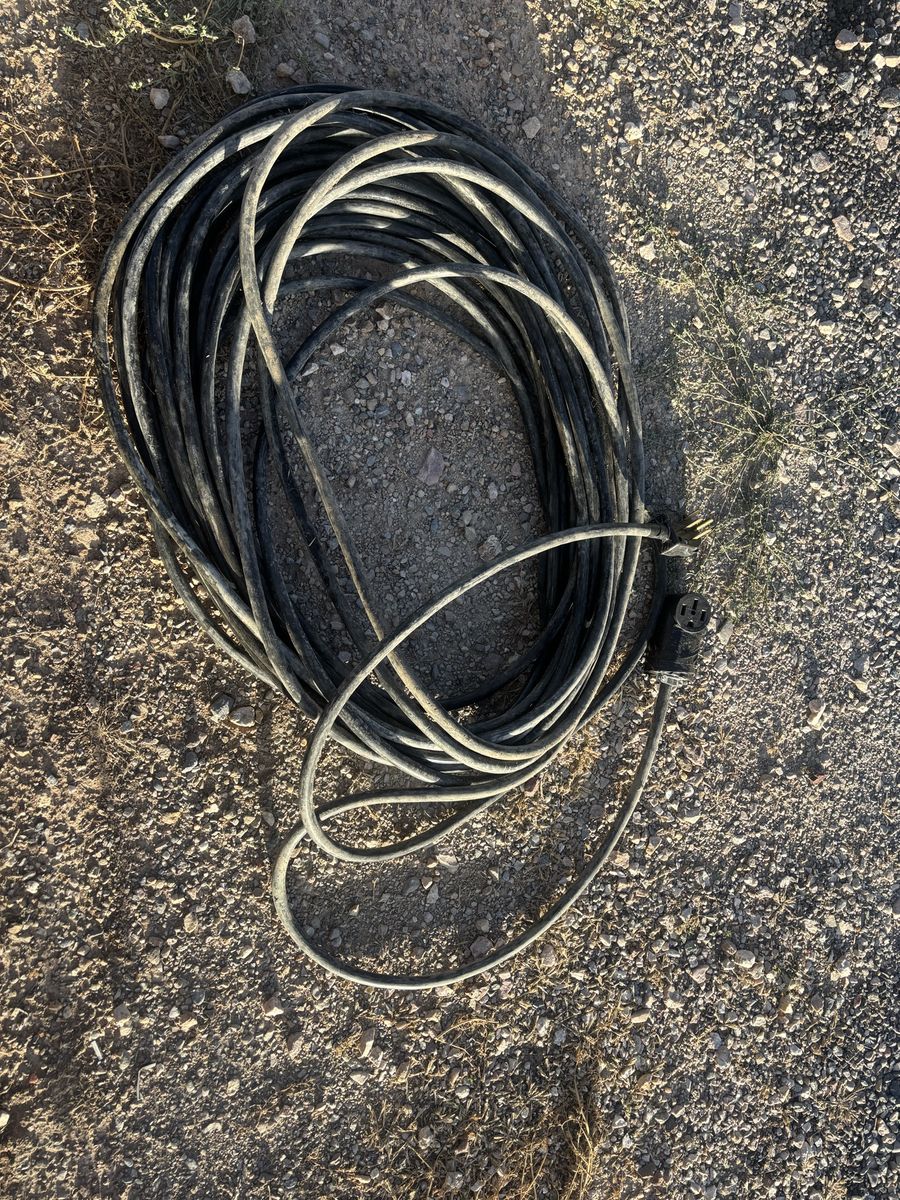 100 ft extension cord  4/10 with flexible rubber casing complete with 4 prong ends for 50 amp. Heavy duty for construction sites