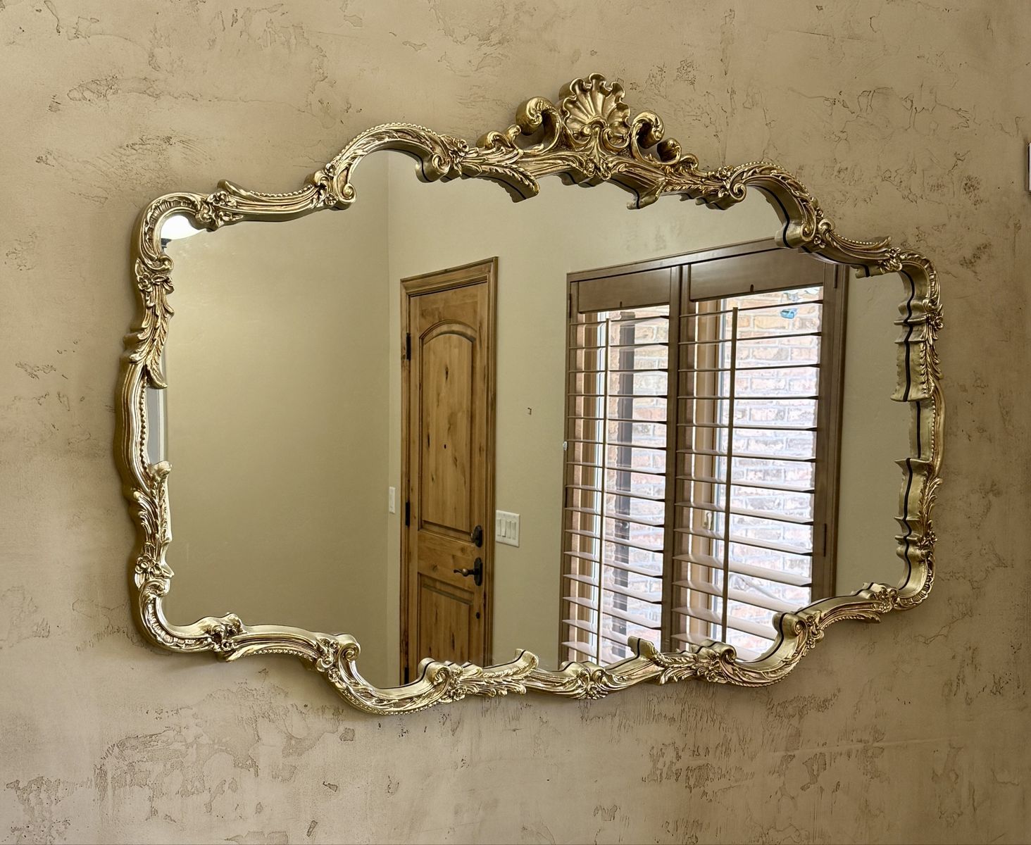 Ornate gold framed mirror