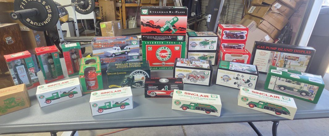 Vintage Sinclair Die-Cast Collectible Toy Vehicles and Airplane Banks in Boxs. Lots of vintage literature and banners and such. 