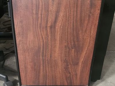 Faux wood–looking mini fridge for sale. Great for an office, bedroom, shop, or garage.