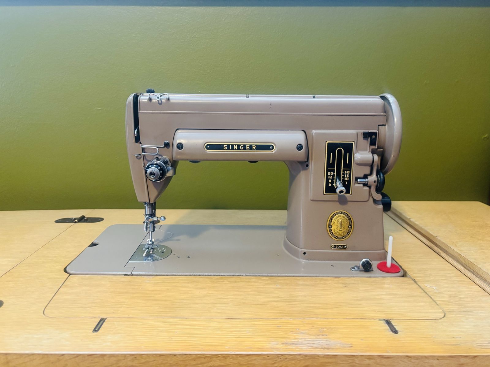 Vintage Singer sewing machine in original cabinet
