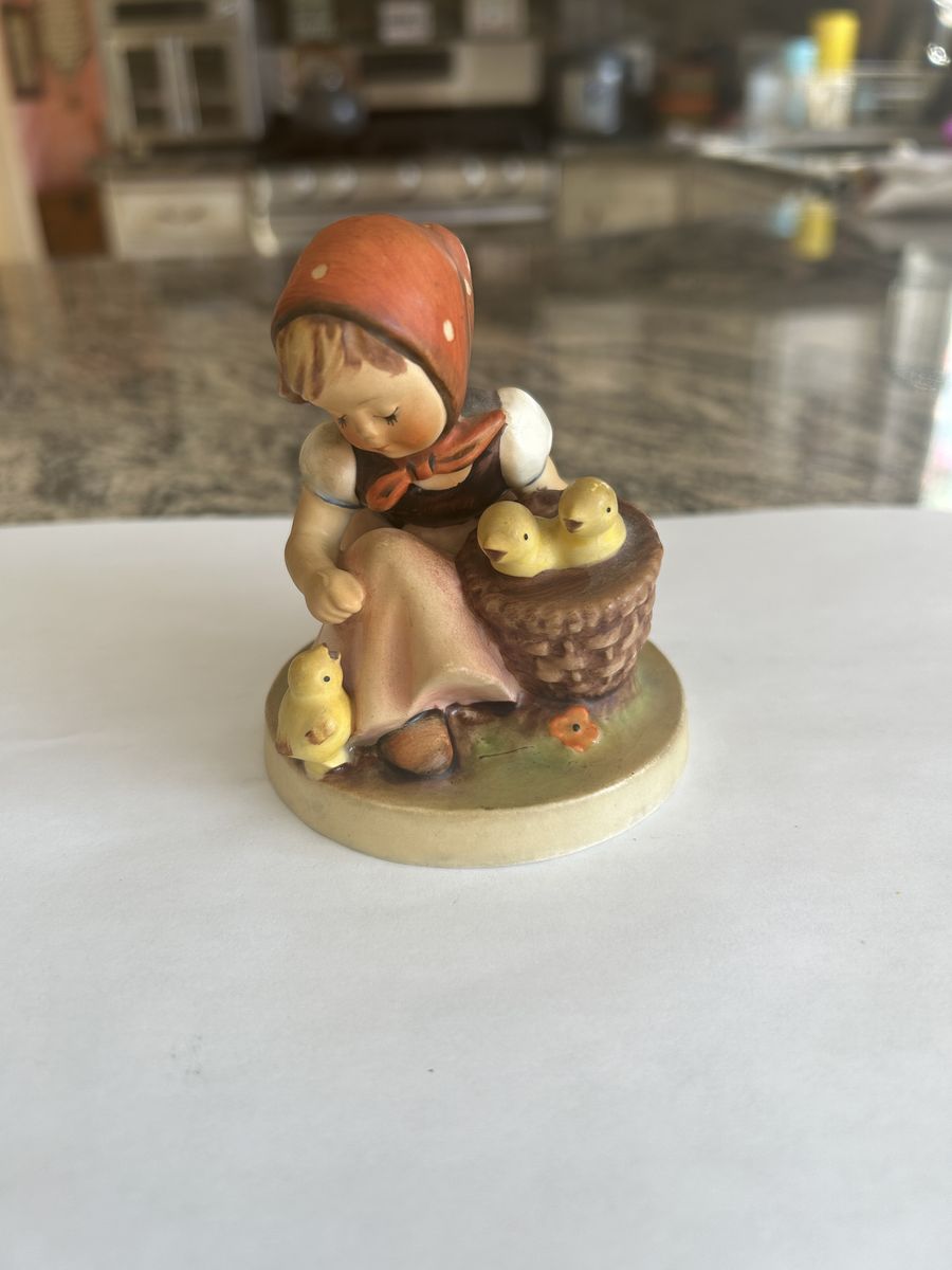 Goebel Hummel figurine titled “Chick Girl”, model 57/0.