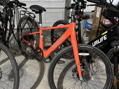 Velotric Discover 1 Step-Thru Electric Bike - Coral / Orange (306 Miles)