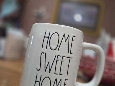 Home Sweet Home Mug - White Ceramic Coffee Cup with "Home Sweet Home" text and green leaf detail and pink Be Mine