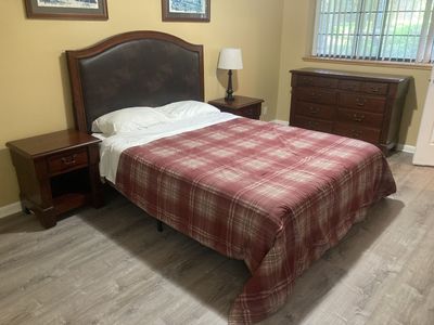 Queen Bed frame, mattress, and Faux leather headboard