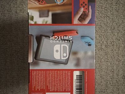 Nintendo Switch Console with Neon Blue and Neon Red Joy-Con in Original Box