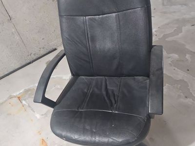Used black faux-leather high-back rolling office chair
