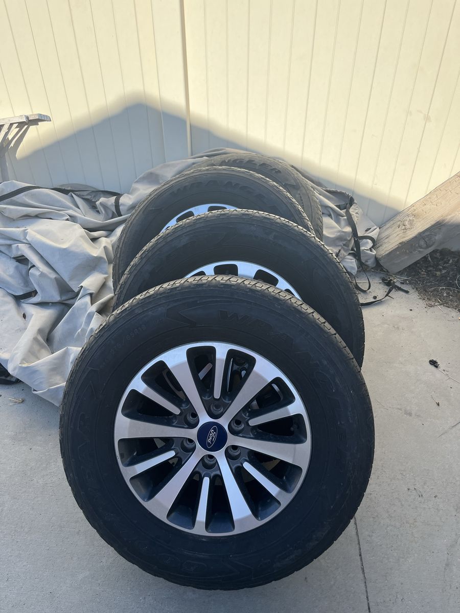 Set of 4 OEM Ford Wheels with Goodyear Wrangler Tires 275/65R18