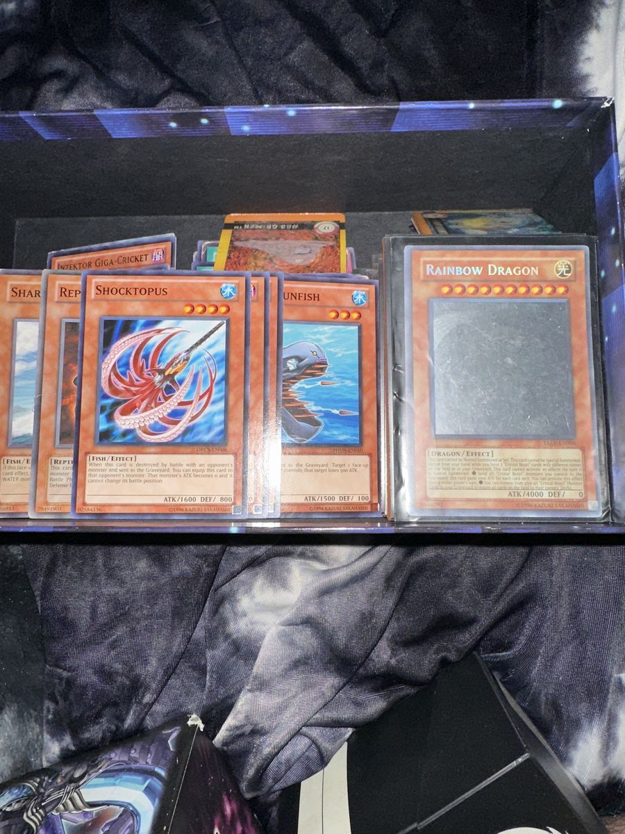 Yu-Gi-Oh cards and card holder book