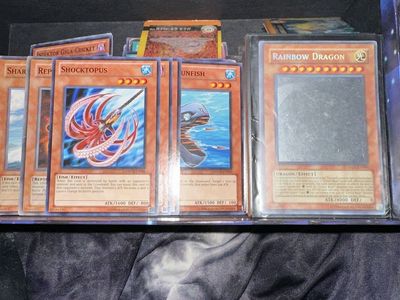 Yu-Gi-Oh cards and card holder book