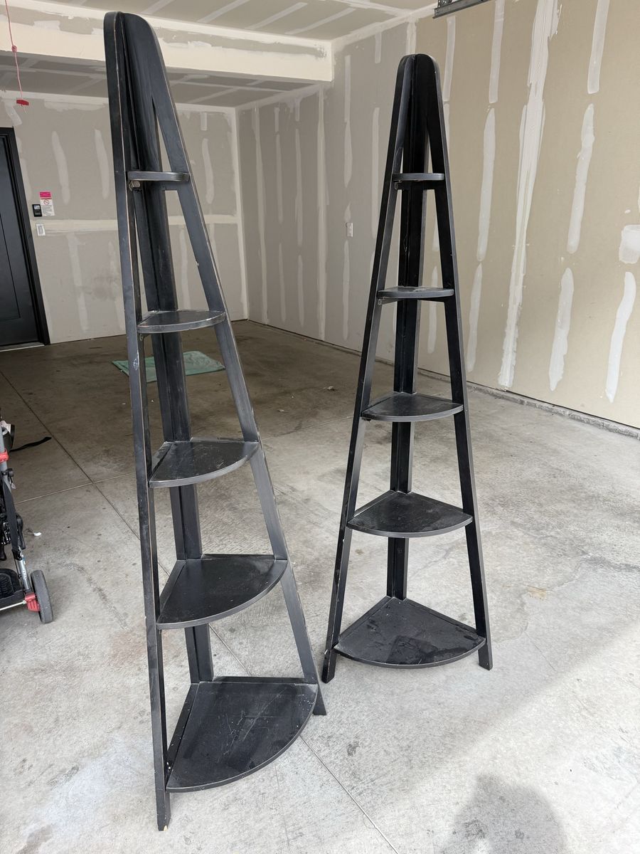 2 black corner shelves